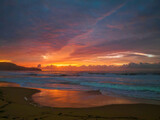Fototapeta Mapy - Cloud covered sunrise at the seaside in pink and blue