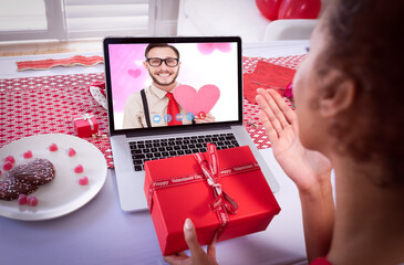 Poster - Diverse couple making valentines date video call the woman blowing kiss to man on laptop screen