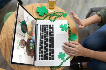 Sticker - Caucasian woman at bar making st patrick's day video call waving to friends in costume on laptop