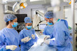 © Graphicroyalty - Surgery operation. Group of surgeons in operating room with surgery equipment. Medical background, selective focus. Surgeon team working together while operation