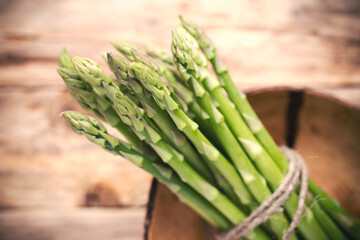 Wall Mural - Asparagus on the wooden background.