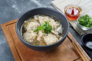 Wall Mural - delicious of wonton soup with chili oil and green onion,chinese food,asian food style 