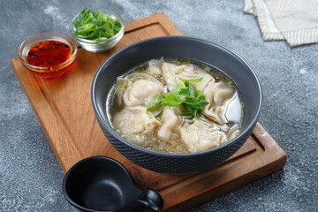 Wall Mural - delicious of wonton soup with chili oil and green onion,chinese food,asian food style 