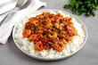 Homemade Cuban Shrimp Creole on a Plate on a gray background, side view.