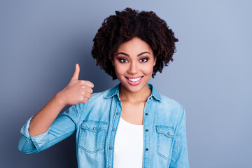 Wall Mural - Portrait of cheerful charming person hand finger show thumb up approve toothy smile isolated on grey color background