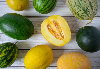 Poster - Variety of melons and water melons on wooden surface. Food backgrounds.