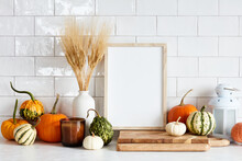 Autumn Still Life. Picture Frame Template, Harvest Of Pumpkins, Dry Wheat On White Table In Scandinavian Kitchen Interior. Autumn Fall, Harvest, Thanksgiving Holiday Concept.