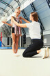 © master1305 - Little girls, beginner gymnastics athletes doing exercises with gymnastics equipment at sports gym, indoors. Concept of studying, achievements, skills