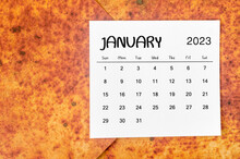 The January 2023 Monthly Calendar For 2023 Year On Red Grunge Background.