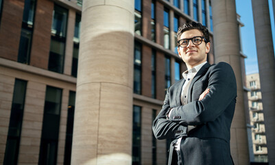 Wall Mural - Confident businessman man with glasses in a business suit