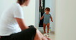 © Marco - Baby development walking at home indoors. One year old toddler infant learning to walk