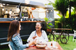© Alessandro Biascioli - Happy multiracial senior friends having fun eating in a street food truck market