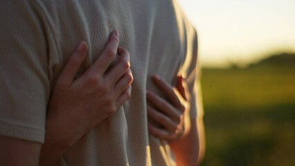 close-up cropped shot of unrecognizable young woman gently and sensually stroking back of boyfriend 