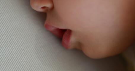 Wall Mural - Baby sleeping close-up macro face . Infant boy drooling during afternoon nap asleep