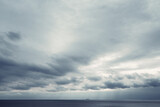 Fototapeta Morze - dark blue sea background, moody sky