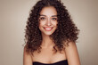 © Oleg Gekman - Fashion studio portrait of beautiful smiling woman with afro curls hairstyle. Fashion and beauty