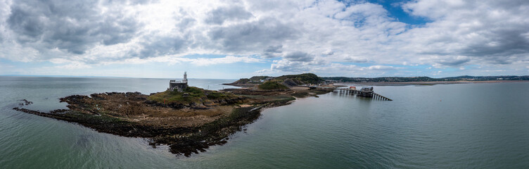 Poster - view of the Mumbles headland with the historic lighthouse and piers in Swansea Bay