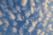 Blue sky with white clouds, cloudy background. Cirrocumulus, Altocumulus, Stratocumulus clouds on blue sky