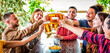 happy weekend. group of friends cheering clincking beer glasses in a pub restaurant celebrating vacation holidays. interracial people drinking together on a social gathering. joy, lifestyle concept