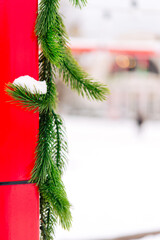 Canvas Print - branches of the Christmas tree with New Year's toys are covered with snow. Festive New Year and Christmas background. Live spruce. Bright winter landscape with snow-covered pines.