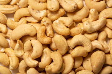 Wall Mural - Cashew nuts as a background, top view. Cashew isolated on white background. Healthy foods.