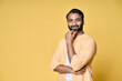 © insta_photos - Confident rich bearded indian man standing isolated on yellow background. Happy handsome ethnic guy wearing shirt looking at camera advertising products thinking on offer for portrait.