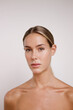 © DondykRiga - beauty portrait with bare shoulders of Caucasian woman looking at camera without makeup