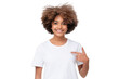 © Damir Khabirov - African student girl pointing with index finger at blank white t-shirt with empty space for your advertising text or image, standing isolated
