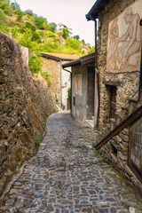 Sticker - Apricale old narrow; Apricale is a small ancient village of stone-made houses above the Ligurian Alps (Northern Italy), close to the borders between Italy and France.