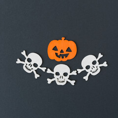 Wall Mural - decorative halloween ornaments (orange pumpkin jack o lantern and three skull and crossbones or jolly rogers)