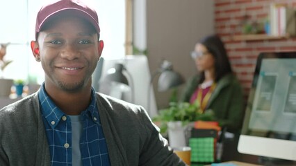Web design, creative designer and computer website at startup company, working on digital app and smile for success at work office. Face portrait of African ux employee in coding business on pc