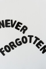 Canvas Print - never forgotten (carefully arranged letters) - black chalk letters