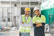 © thanmano - Working Safety at Workplace Concept, Portrait of Construction Workman with safety jackets and helmets on construction site