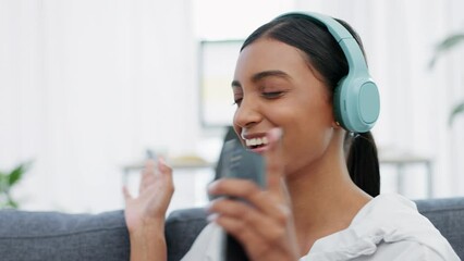 Poster - Music, dance and phone with a woman streaming audio on wireless headphones while on her sofa to relax at home on the weekend. Radio, freedom and wifi with a happy young female enjoying free time