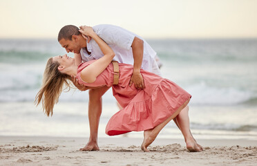 Canvas Print - Love, dance and couple dancing at the beach in summer celebrate their marriage, happiness and honeymoon vacation. Smile, sunset and happy woman celebrating a healthy relationship with partner at sea