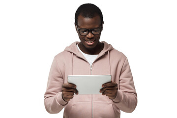 Poster - Studio closeup of young African American man pictured wearing eyeglasses looking attentively to screen of tablet he is holding