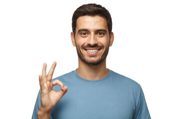 young smiling man having happy look, gesturing, showing ok sign or showing okay gesture with his fin