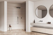 © ImageFlow - Corner view on bright bathroom interior with large round mirrors,
