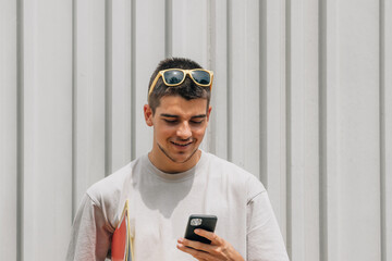 Poster - student with books and mobile phone in the street