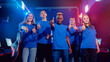 © Parilov - Multi cultural team gamers caucasian, african, asian of professional online video game players, neon color soft focus. Concept tournament cyber esport
