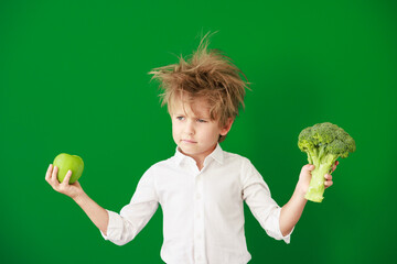 Poster - Surprised child against green chalkboard in class