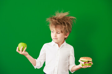 Poster - Surprised child against green chalkboard in class