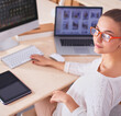 © shefkate - Young woman working in office, sitting at desk