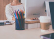 © shefkate - Young woman working in office, sitting at desk