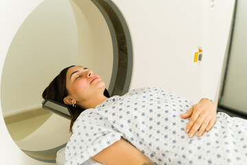 Wall Mural - Relaxed happy woman getting a cat scan to check her health