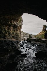 Poster - Scenic view of Smoo cave with combined sea cave and freshwater cave in Sutherland, Scotland