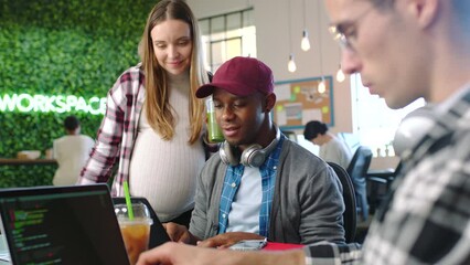 Pregnant woman, laptop coding or teamwork help in collaboration digital software innovation with business people. Cyber security, web design or programming code for technology app in creative office