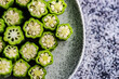 © RooM The Agency - Overhead view of chopped okra on a plate