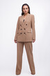 © SBekhinov - Fashion photo of a beautiful elegant young woman in a pretty oversize brown and beige suit, jacket, pants, stylish sunglasses posing over white background. The hair is gathered back, dark brunette.