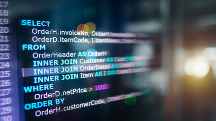 Wall Mural - sql (structured query language) code on computer monitor with database and server room background. e